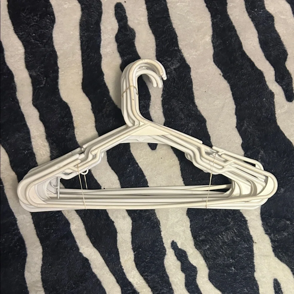 30 white plastic hangers bundle
